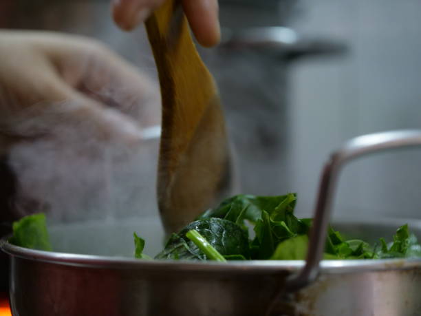 istock spinach leaves in a skillet 1348026386