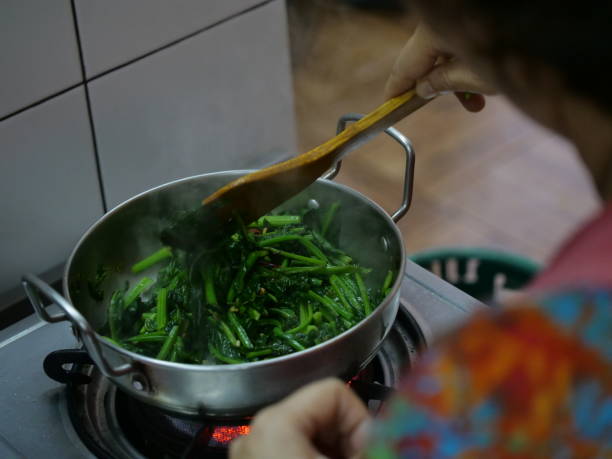 istock spinach leaves in a skillet 1348026390