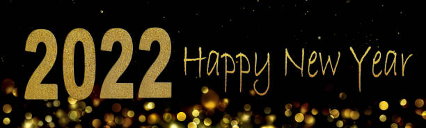 istock 2022 Happy new year on abstract blur lights in the night in panoramic view 1348026500