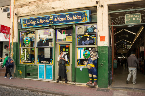 Horizontal view of La Vieja Rotiseria de Nonno Bachicha restaurant exterior beside San Telmo Market entrance, San Telmo neighborhood, Buenos Aires