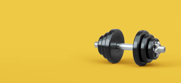 istock Realistic Dumbbell on yellow background. 3d rendered illustration. 1348028038