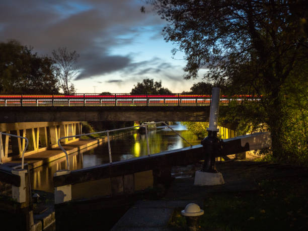 istock Vehicle light trails on bridge over canal 1348028268