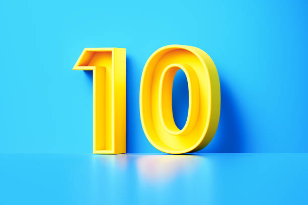 numero dieci giallo seduto su sfondo blu - tenths foto e immagini stock