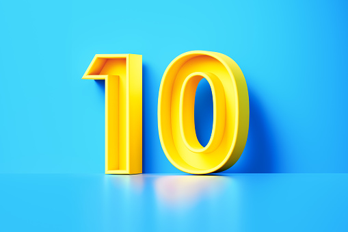 Yellow Number Ten Sitting On Blue Background