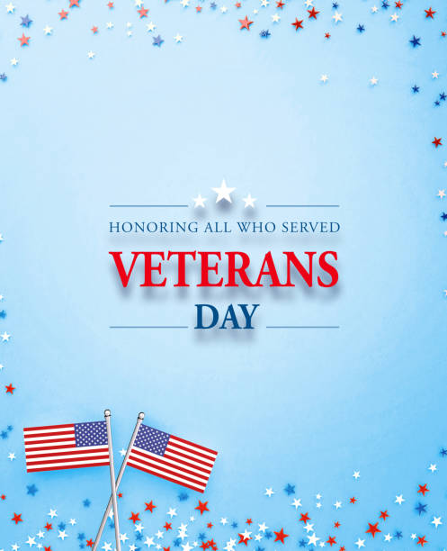 istock Veterans Day Concept - Veterans Day Message Sitting Amid American Flags And Star Shaped Confetti On Blue Background 1348030749