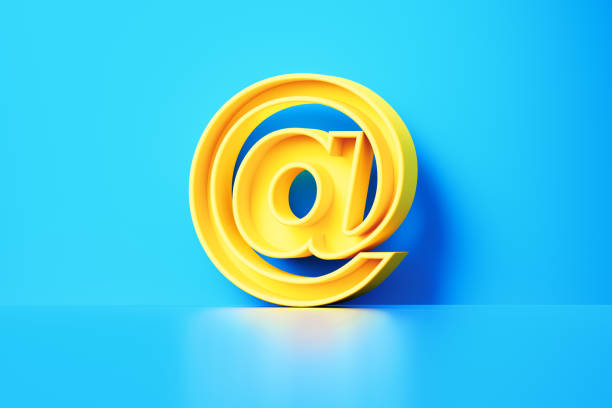 Yellow at symbol sitting on blue background. Horizontal composition with copy space.