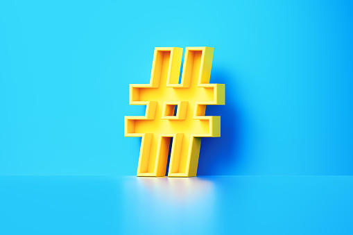 Yellow Hashtag Symbol Sitting On Blue Background