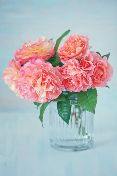 istock Many beautiful fresh pink roses on a table. 1348032311