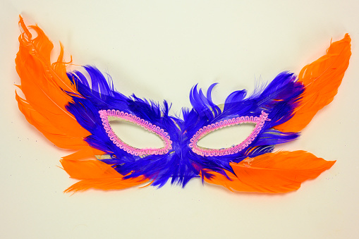 Multi colored ornate carnival mask on the white background