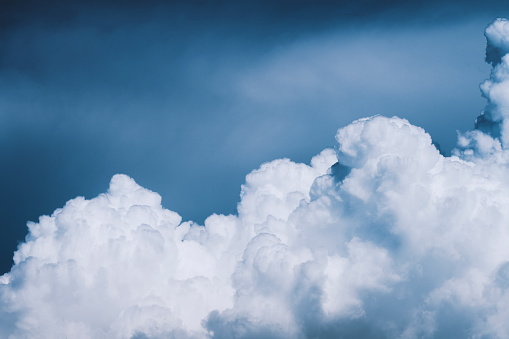 Light growing clouds in the blue sky. Natural background. Web banner.