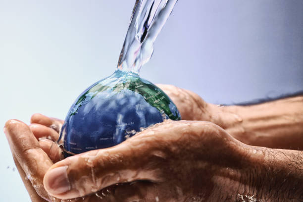 istock Water pouring on planet earth 1348033352