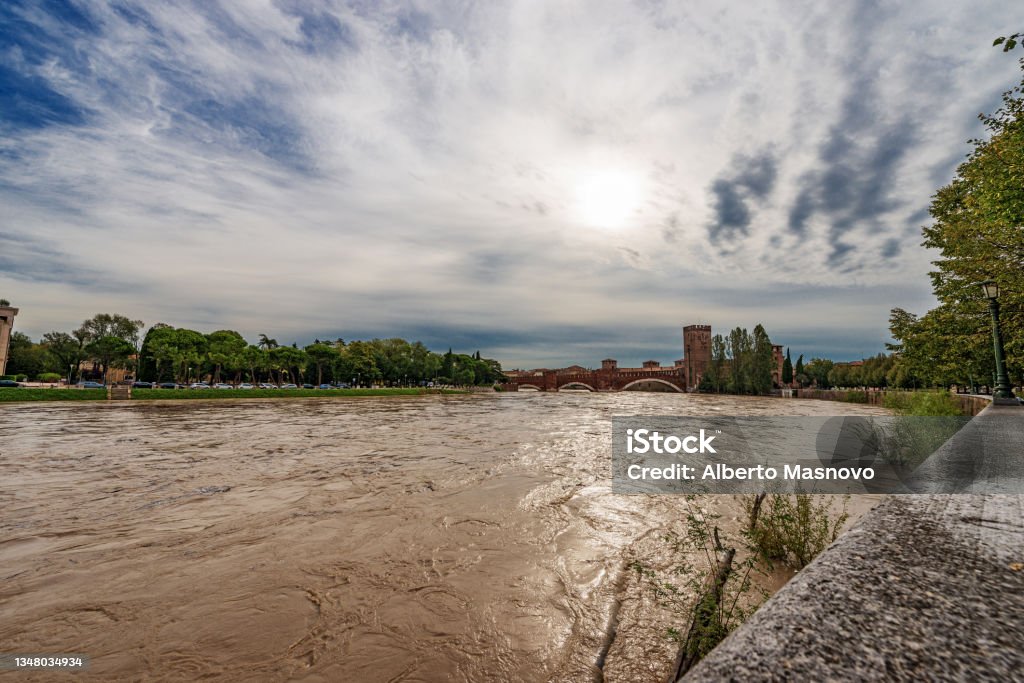 Adige river in flood in Verona downtown after several violent storms Adige river in flood in Verona downtown after several violent storms. Castle of Castelvecchio and the Scaliger Bridge. UNESCO world heritage site, Veneto, Italy, Europe. River Stock Photo