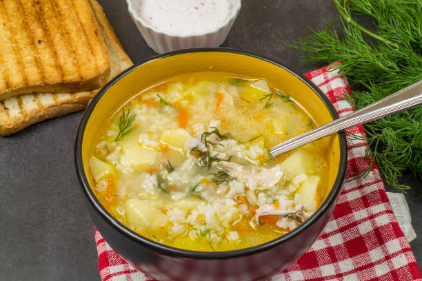 istock Deep plate of chicken rice soup on the table 1348035748