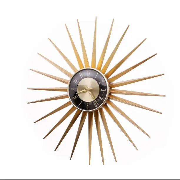 Photo of Old vintage star or sun shaped wall clock