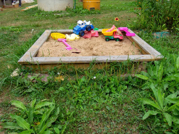 istock sandbox with plastic toys in the village 1348044303