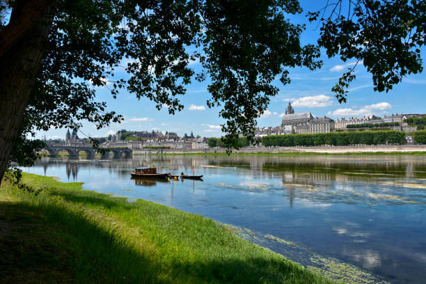 Edge of the Loire at Blois in France Edge of the Loire at Blois, a commune and the capital city of Loir-et-Cher department in Centre-Val de Loire, France,situated on the banks of the lower river Loire between Orléans and Tours blois stock pictures, royalty-free photos & images