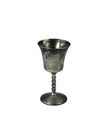 Ancient chalice made of silver on white background