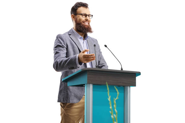 istock Bearded man giving a speech on a podium 1348049688