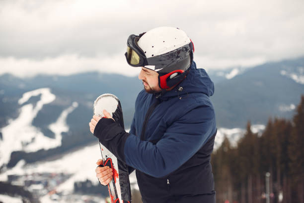 istock Man snowboarding in the mountains with the snowboard 1348050858