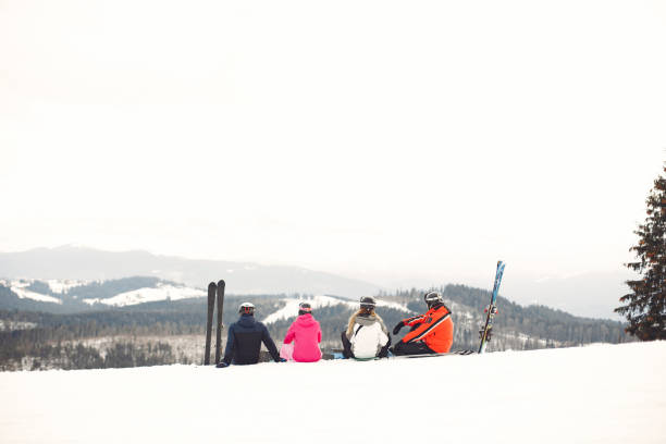 istock People snowboarding in the mountains with the snowboard 1348051027