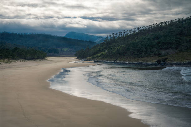 istock The waves cover a beach as the tide rises 1348053626