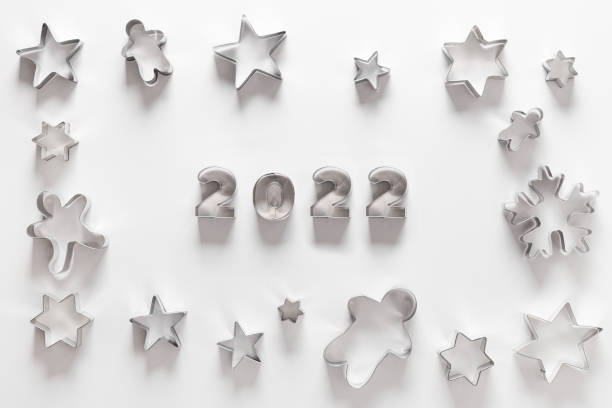 Christmas-themed cookie cutters as frame. Xmas greeting card.