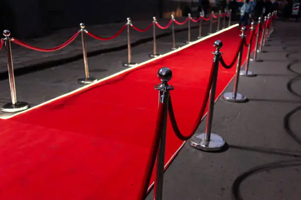 Red Event Carpet, Stair and Gold Rope Barrier Concept of Success and Triumph