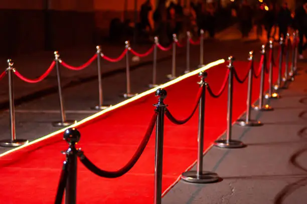 Red Event Carpet, Stair and Gold Rope Barrier Concept of Success and Triumph