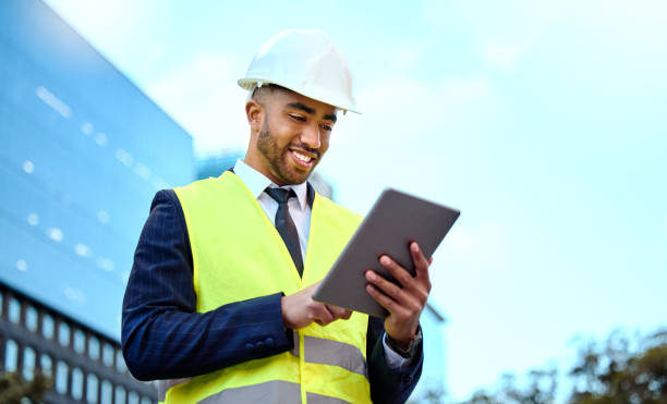 istock Shot of a young businessman on a construction site using a digital tablet 1348061282