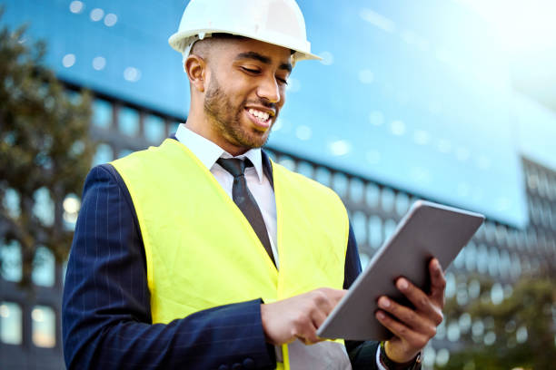 istock Shot of a young businessman on a construction site using a digital tablet 1348061286