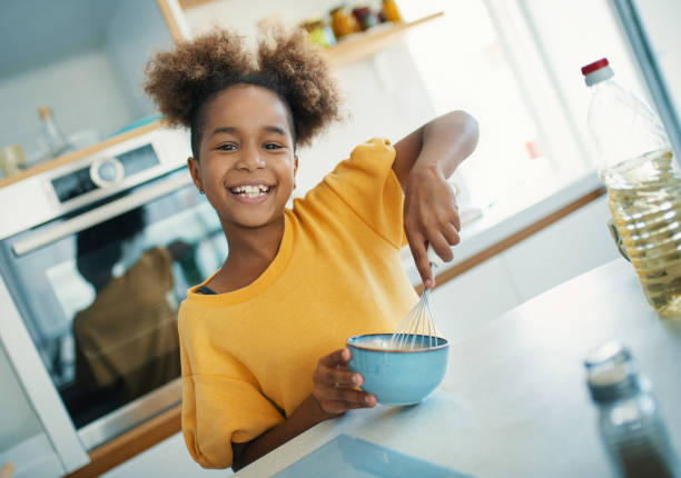 istock Little girl playing in the kitchen. 1348066947