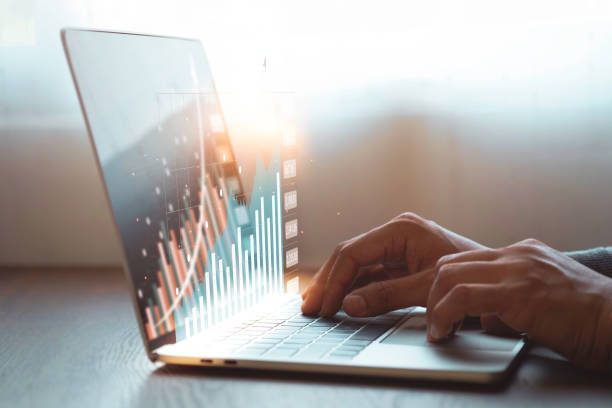 istock A man hand using and typing keyboard of laptop computer analyzing sales data and economic growth plan graph chart success. 1348067224