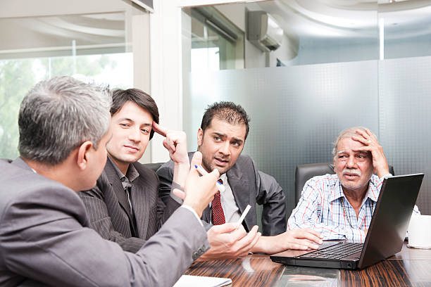 istock worried businessmen in a meeting 134806872