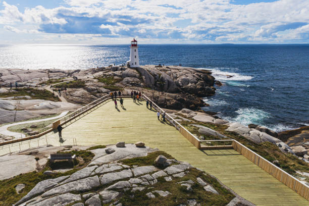 Peggy's Cove Lighthouse Aerial drone view of Peggy's Cove lighthouse and the newly completed accessible observation deck & walkways. peggys cove stock pictures, royalty-free photos & images