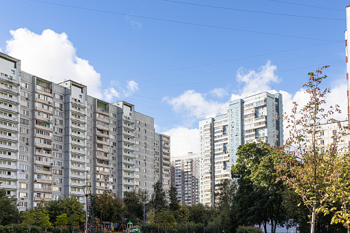 municipal high-rise apartment houses under blue sky in Moscow city on sunny day