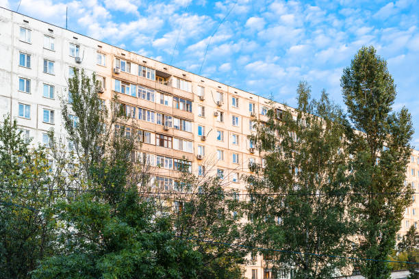 istock sunlit residential multi-storey building and trees 1348071873
