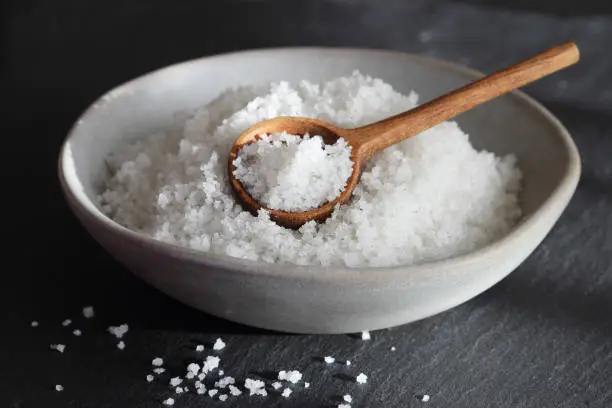 Photo of Flower of salt from Guerande - France. Traditional french natural sea salt of high quality hand - harvested in the salt marshes.