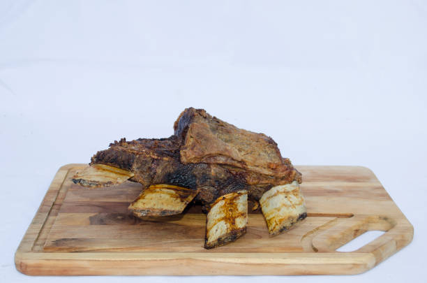 roasted nellore beef rib arranged in wooden tacbia