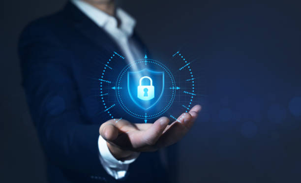istock Businessman holding padlock in hand. Network security and data protection. 1348075155