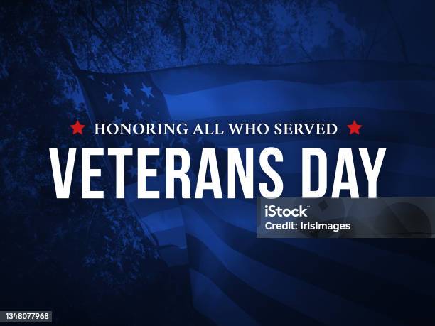 Veterans Day Honoring All Who Served Holiday Card With Waving American Flag Over Dark Blue Background Stock Photo - Download Image Now