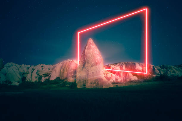 istock Stunning rectangular shape night exposure in Cappadocia with fairy chimneys, geographic houses and landscape made with neon light 1348078028