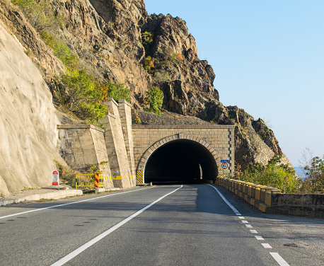 Road and road tunnel that passes through the mountains.