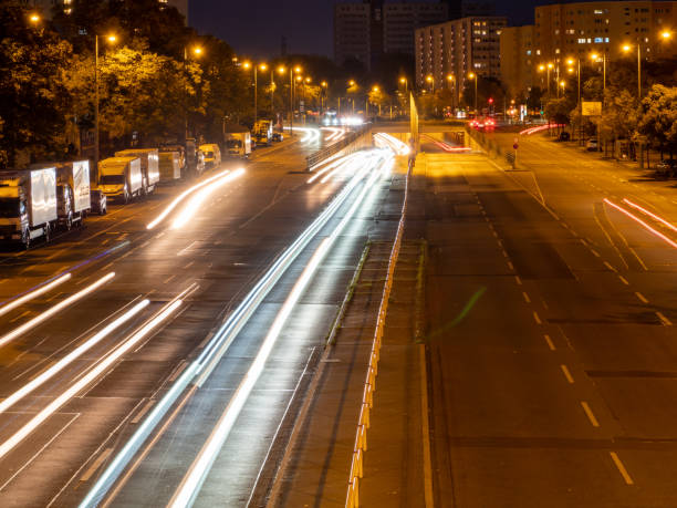 istock light trails on a city highway. Night city 1348082182