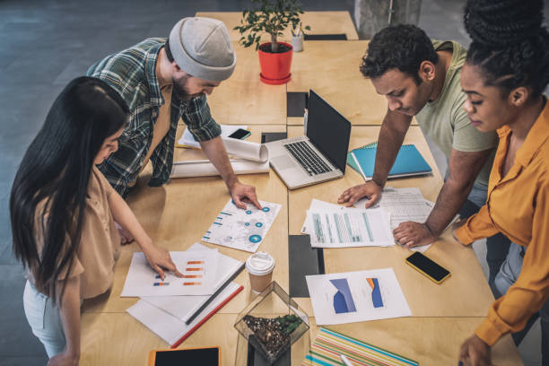 istock Young people in process of working on project 1348082456