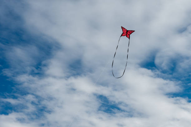 istock Colorful Kites flying over the sky 1348083877