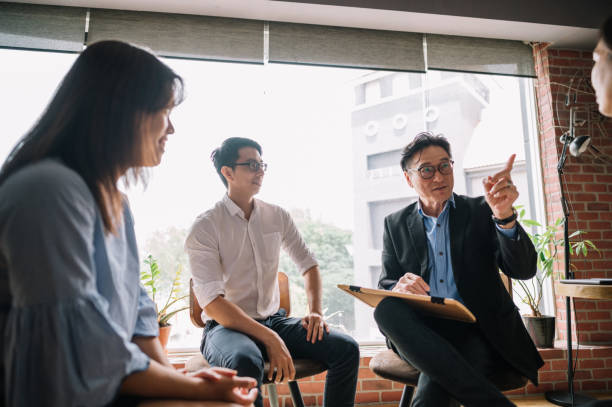 istock The group listens as the therapist makes a point 1348084561
