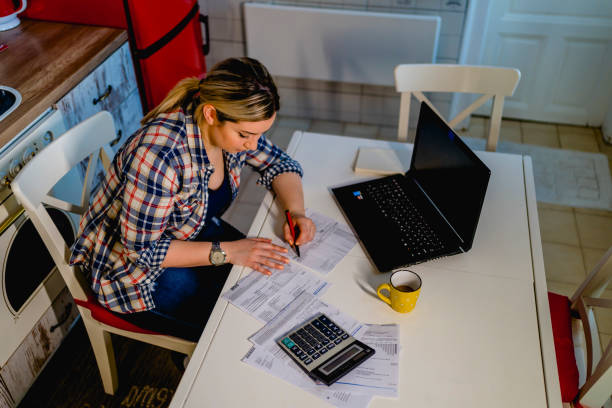 istock Young woman manage household finances 1348085101