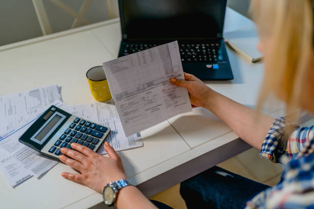istock Woman calculating budget 1348085251