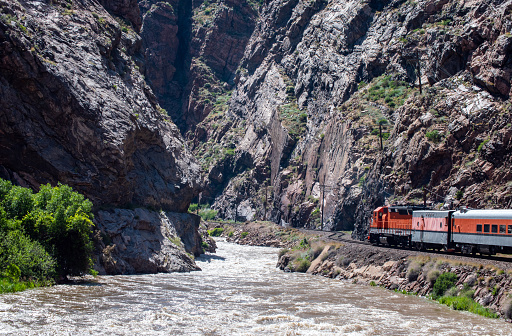 The Colorado Rockies boasts an beautiful and exciting train ride for tourists to enjoy the magnificence of the mountain pass and flowing river.