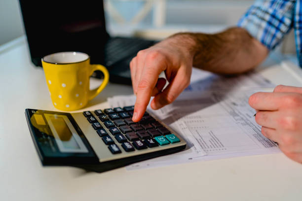 istock Man calculating family budget 1348086056